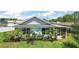 Well-maintained home with lush landscaping and screened porch at 33635 Jeffery Ct, Leesburg, FL 34788