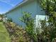Landscaped exterior with neatly maintained planting beds at 33635 Jeffery Ct, Leesburg, FL 34788