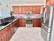 Well-equipped kitchen featuring stainless steel appliances, ample cabinet space, and a stylish backsplash at 33635 Jeffery Ct, Leesburg, FL 34788