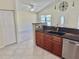 Modern kitchen with stainless steel appliances and breakfast bar, perfect for casual dining and entertaining at 33635 Jeffery Ct, Leesburg, FL 34788