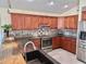 Modern kitchen featuring stainless steel appliances, granite countertops, and ample storage at 33635 Jeffery Ct, Leesburg, FL 34788