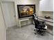 Functional office space featuring built-in desk, tiled floors, and an ergonomic chair for a comfortable workspace at 33635 Jeffery Ct, Leesburg, FL 34788