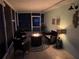 Screened patio with fire pit and cozy seating at 33635 Jeffery Ct, Leesburg, FL 34788