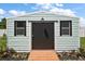 Storage shed has double windows and a ramp for easy access at 33635 Jeffery Ct, Leesburg, FL 34788