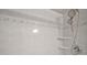 Shower with custom tilework, dual shower heads, and corner shelves at 33635 Jeffery Ct, Leesburg, FL 34788