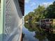 Peaceful waterfront view featuring a private dock and boat access at 33635 Jeffery Ct, Leesburg, FL 34788