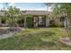 The home features a private, tree-lined backyard at 340 Juniper Way, Tavares, FL 32778