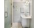 Clean bathroom with marble floors, white walls, and a glass shower at 340 Juniper Way, Tavares, FL 32778