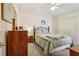 Cozy bedroom featuring a comfortable bed, ceiling fan, and ample closet space at 340 Juniper Way, Tavares, FL 32778