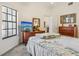 Comfortable bedroom featuring a television, ceiling fan and neutral paint palette at 340 Juniper Way, Tavares, FL 32778