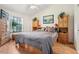 Bedroom with neutral walls, wood floors, and window at 340 Juniper Way, Tavares, FL 32778