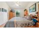 Bedroom with neutral walls, wood floors, and view from the window at 340 Juniper Way, Tavares, FL 32778