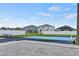 Community outdoor sports court surrounded by well-maintained lawns and white fencing in a suburban neighborhood at 340 Juniper Way, Tavares, FL 32778