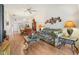 Spacious living room with laminate floors and plenty of natural light with an open layout to the kitchen at 340 Juniper Way, Tavares, FL 32778