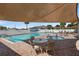Relaxing community pool and hot tub featuring sunshade and patio seating at 340 Juniper Way, Tavares, FL 32778