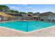 Large community pool featuring sunshade and nearby lounge seating at 340 Juniper Way, Tavares, FL 32778