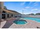 Outdoor pool area with whirlpool, patio seating, and covered sunshade at 340 Juniper Way, Tavares, FL 32778