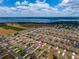 An aerial view of the neighborhood, showing a lake in the distance at 37045 Scenic Ridge Dr, Grand Island, FL 32735