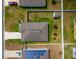 Aerial shot of the property showcasing the roof, yard, and neighborhood at 37045 Scenic Ridge Dr, Grand Island, FL 32735