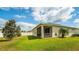 Expansive backyard featuring a screened-in patio and a storage shed, perfect for outdoor living at 37045 Scenic Ridge Dr, Grand Island, FL 32735