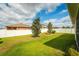 The property boasts a lush green lawn and a privacy fence at 37045 Scenic Ridge Dr, Grand Island, FL 32735