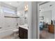 Bathroom with a tub-shower combo and glimpse into the bedroom at 37045 Scenic Ridge Dr, Grand Island, FL 32735