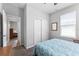 Bedroom featuring closet doors and an adjoining room in view at 37045 Scenic Ridge Dr, Grand Island, FL 32735