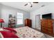 Bedroom with a ceiling fan, a window, and a queen-sized bed at 37045 Scenic Ridge Dr, Grand Island, FL 32735