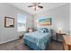 Bedroom with a cozy armchair and a beach-themed painting at 37045 Scenic Ridge Dr, Grand Island, FL 32735