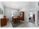 Dining room with wood floors, a wood dining set, and a china cabinet at 37045 Scenic Ridge Dr, Grand Island, FL 32735