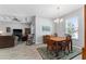 Dining room with a wood dining set and views into the living room and kitchen at 37045 Scenic Ridge Dr, Grand Island, FL 32735