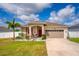 Charming single-Gathering home with a well-manicured lawn and two-car garage at 37045 Scenic Ridge Dr, Grand Island, FL 32735