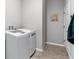 Functional laundry room with a modern washing machine and practical storage solutions at 37045 Scenic Ridge Dr, Grand Island, FL 32735