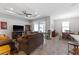 Open concept living room with furniture, light-colored walls, and a sliding glass door to the outside at 37045 Scenic Ridge Dr, Grand Island, FL 32735