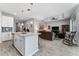 Open-concept kitchen and living area featuring granite countertops and a view of the living space at 37045 Scenic Ridge Dr, Grand Island, FL 32735