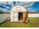 Shed doors open reveal some stored items and tools at 37045 Scenic Ridge Dr, Grand Island, FL 32735