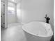 Elegant bathroom featuring a soaking tub and a separate shower at 3978 Sw 151St St, Ocala, FL 34473