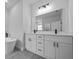 Modern bathroom with double vanity, sleek black fixtures, and a soaking tub at 3978 Sw 151St St, Ocala, FL 34473