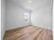 Bright bedroom featuring light wood flooring, closet, and neutral paint at 3978 Sw 151St St, Ocala, FL 34473