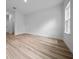 Bright bedroom featuring wood-look flooring and a window that lets in natural light at 3978 Sw 151St St, Ocala, FL 34473