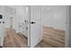 Bright hallway featuring modern fixtures and wood-look floors at 3978 Sw 151St St, Ocala, FL 34473