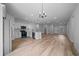 Open floor plan of kitchen with stainless steel appliances and a large island with pendant lighting at 3978 Sw 151St St, Ocala, FL 34473