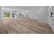 Spacious living room featuring stylish hardwood floors and an open layout, great for entertaining at 3978 Sw 151St St, Ocala, FL 34473