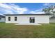 Simple outdoor patio area and sliding glass door on a modern white home exterior at 3978 Sw 151St St, Ocala, FL 34473