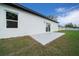 New patio and sliding glass door entry featured on new white home exterior at 3978 Sw 151St St, Ocala, FL 34473