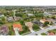 Aerial view of homes featuring large lots, mature trees and landscaping in a suburban setting at 4147 Oaktree Dr, Davenport, FL 33837