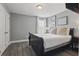 Serene bedroom with a full bed, soft lighting, and a decorative gallery wall at 4147 Oaktree Dr, Davenport, FL 33837