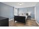 Serene bedroom with blue walls, comfortable bedding, and stylish bedside tables at 4147 Oaktree Dr, Davenport, FL 33837