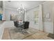 Contemporary dining room featuring a modern chandelier and neutral decor at 4147 Oaktree Dr, Davenport, FL 33837