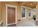 A charming front porch featuring a door and windows at 4147 Oaktree Dr, Davenport, FL 33837